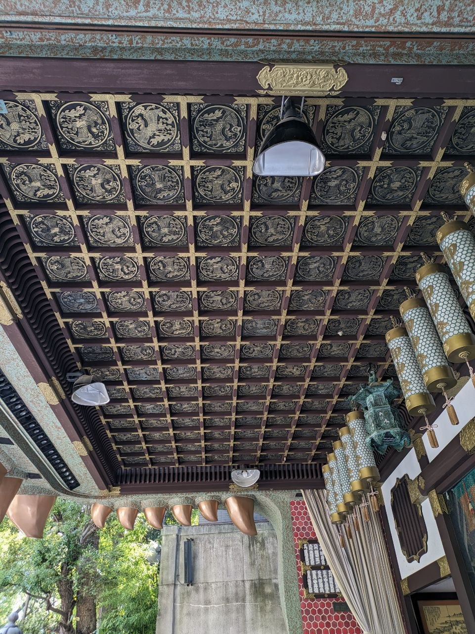 Courtyard of Namba Yasaka Shrine surrounded by city buildings