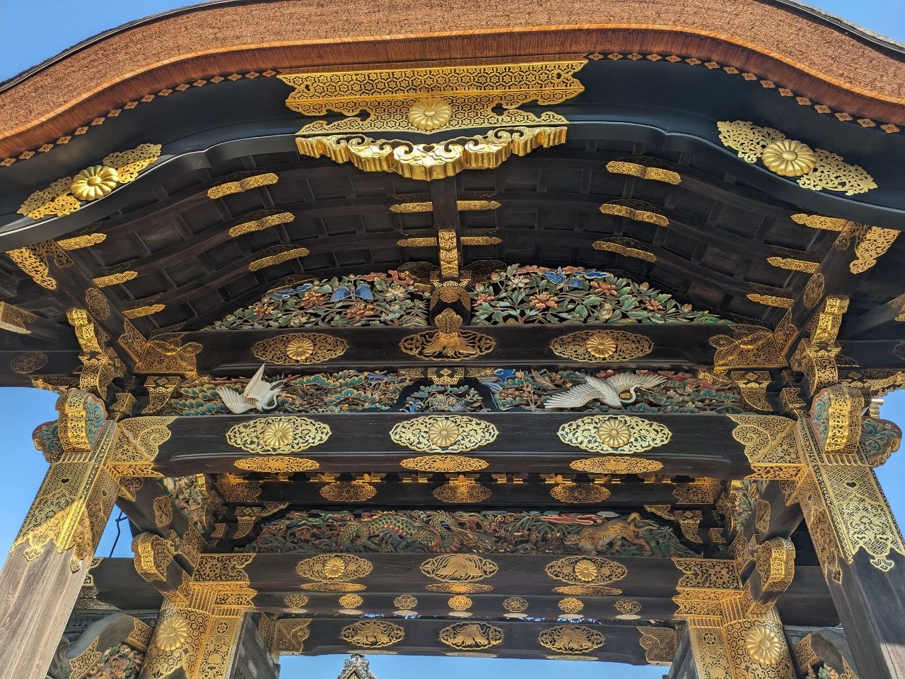 Intricate gold and colored woodcarvings on the Karamon gate at Nijo Castle