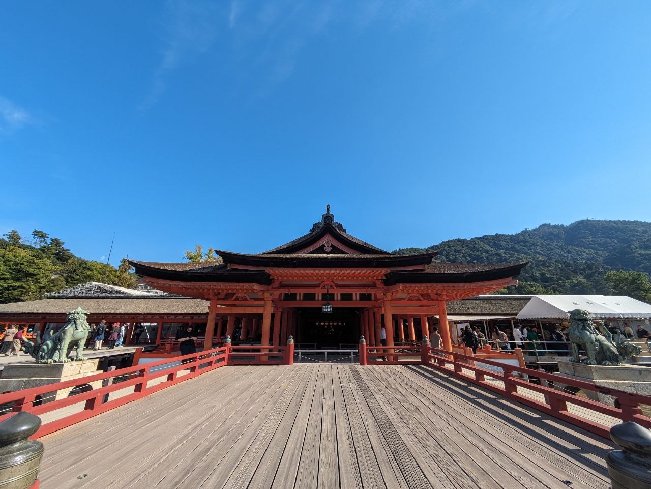 Main gate of Itsukushima Shrine with guardian lion statues