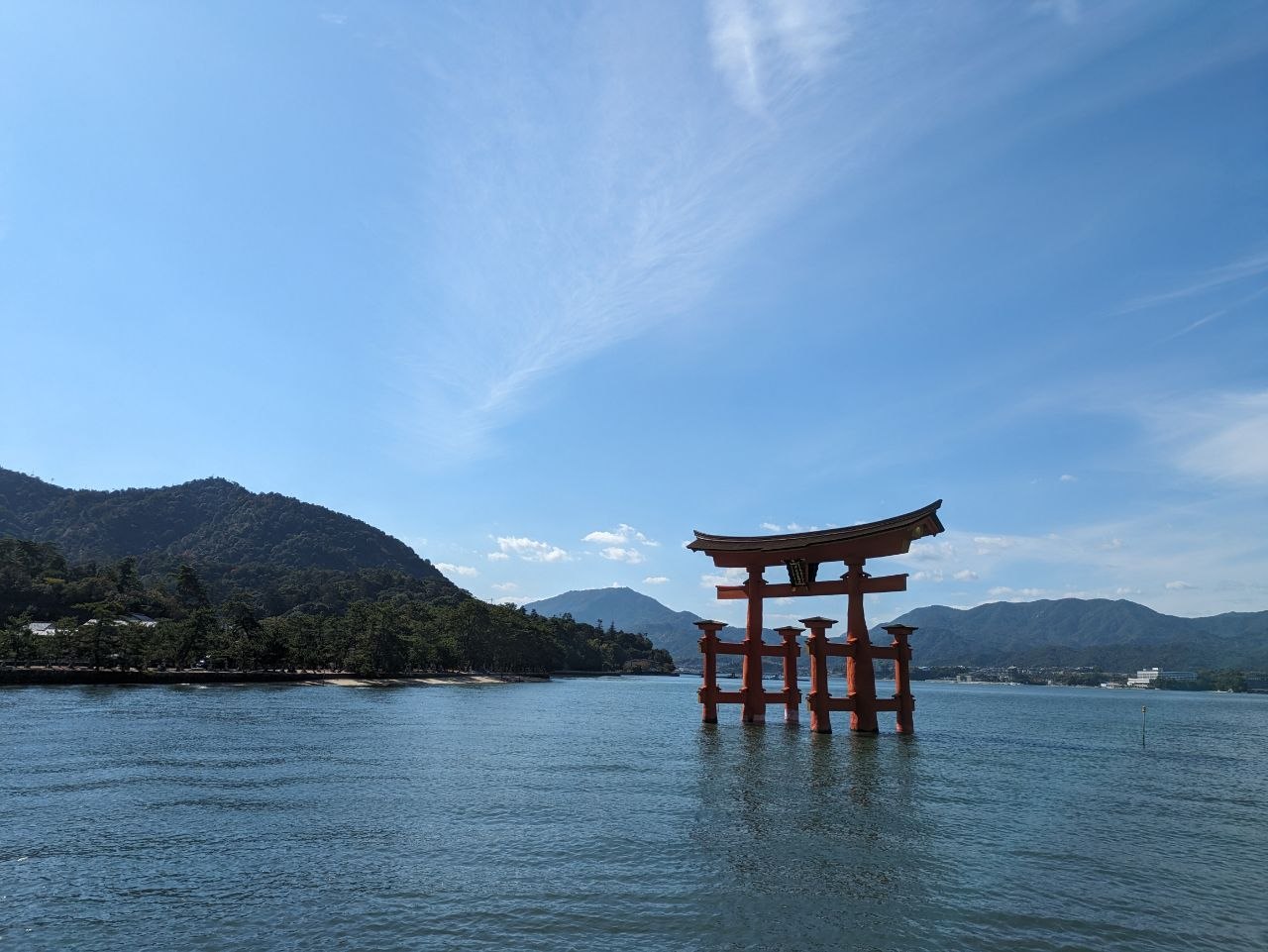 Wide view of the o-torii gate standing in the sea at Miyajima