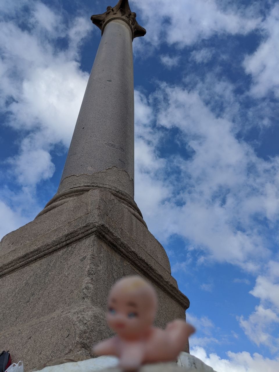 Pompey's Pillar rising against a blue sky in Alexandria, Egypt