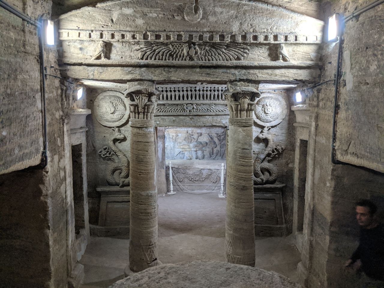 Main burial chamber of the Catacombs of Kom el Shoqafa with carved columns and Egyptian-Greco-Roman relief decoration