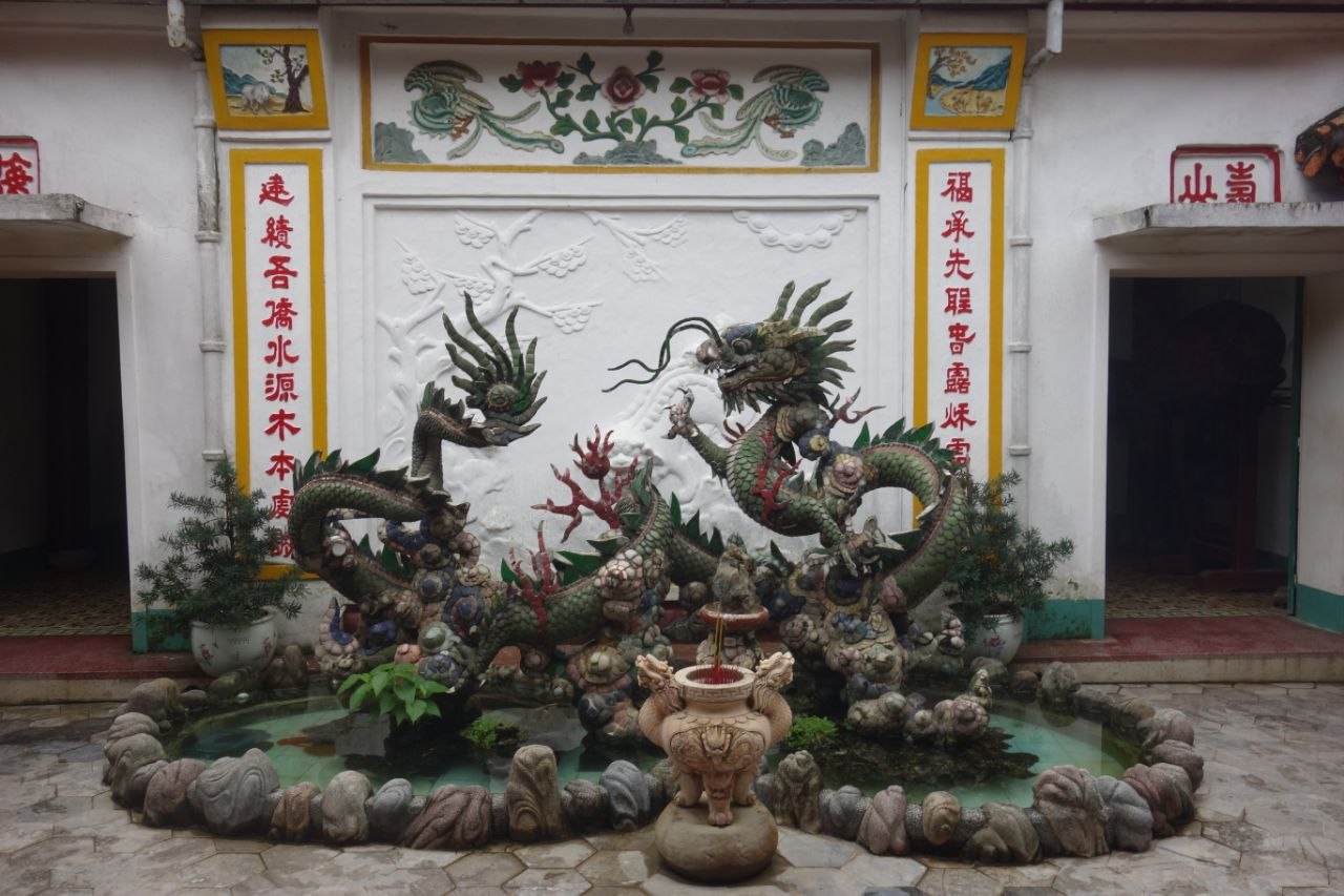 Ceramic mosaic dragon sculpture in the courtyard of a Chinese assembly hall in Hoi An