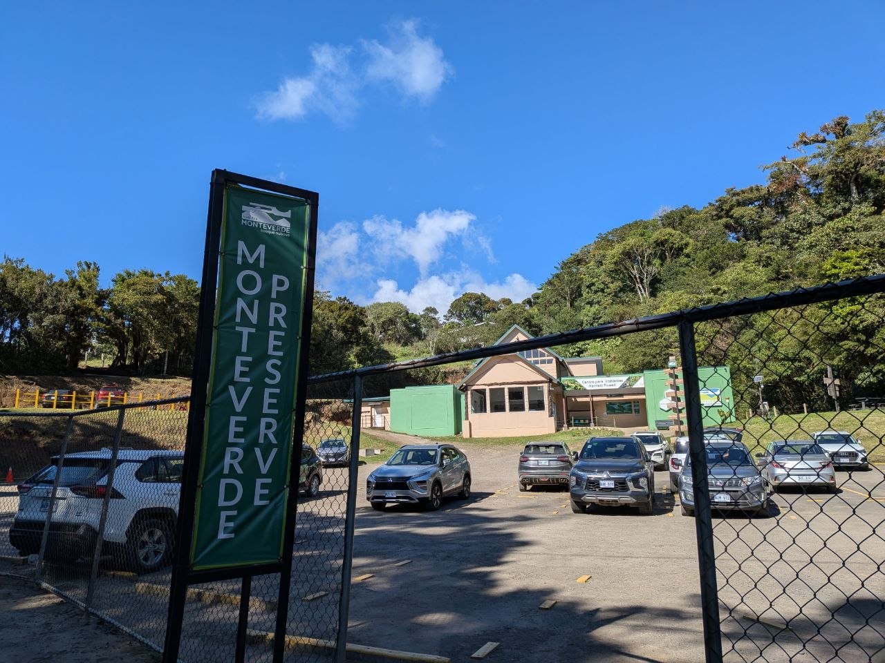 The entrance to the Monteverde Cloud Forest Biological Reserve with a green Monteverde Preserve sign, Costa Rica